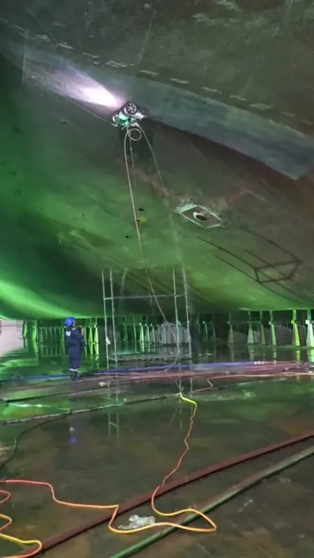 Night shift — robot on the stern under floodlights